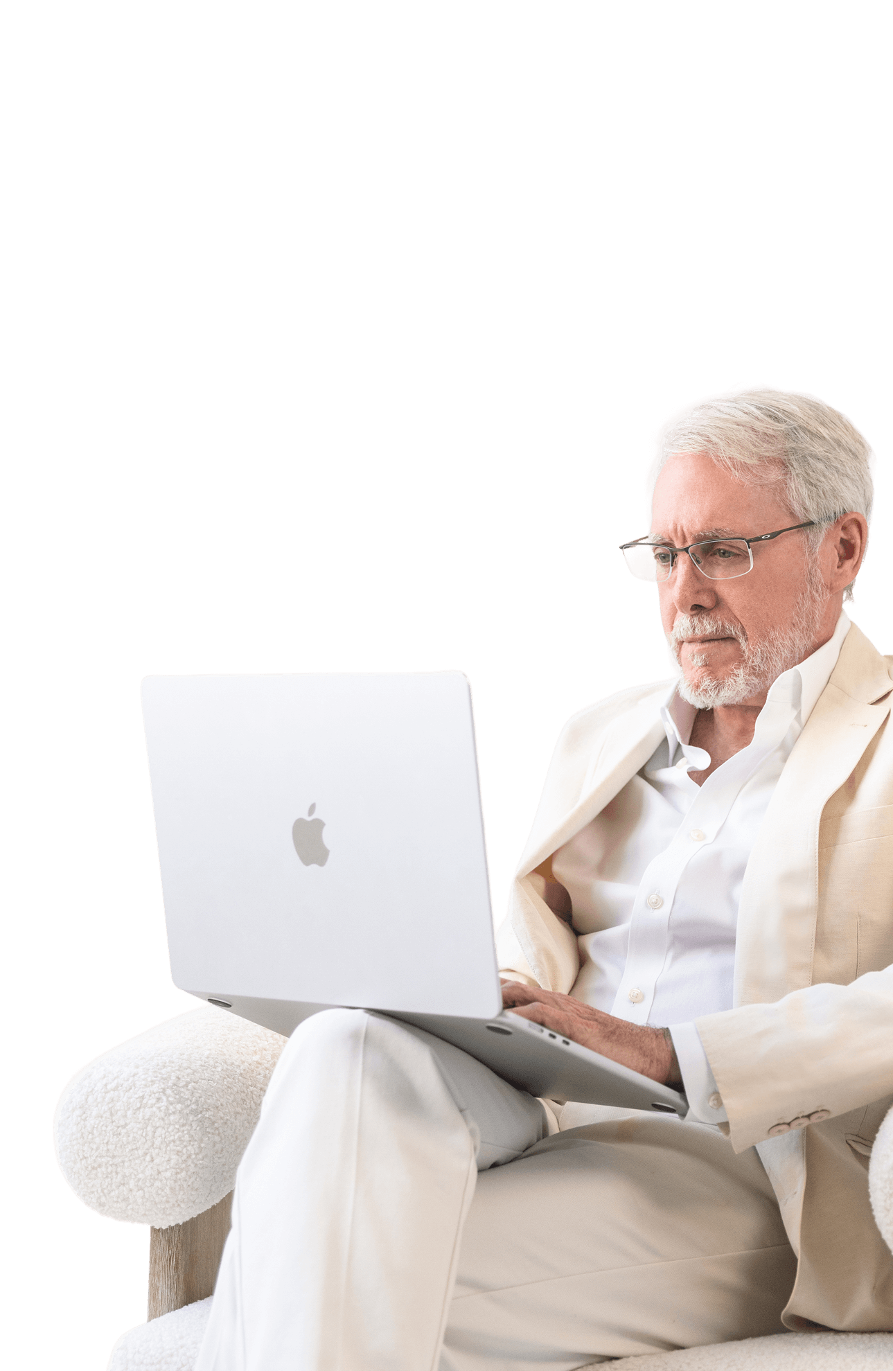 Bill Harris in a suit using a laptop