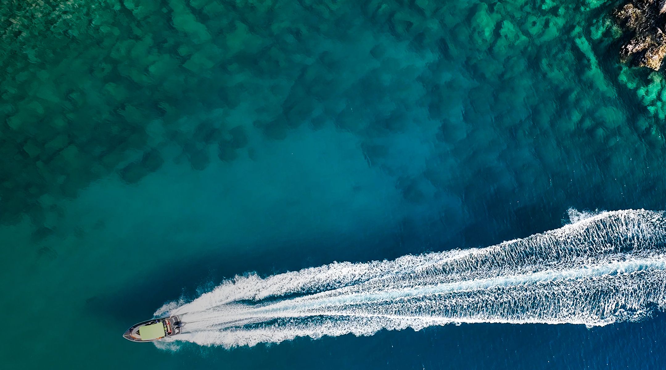 Yacht in clear ocean water