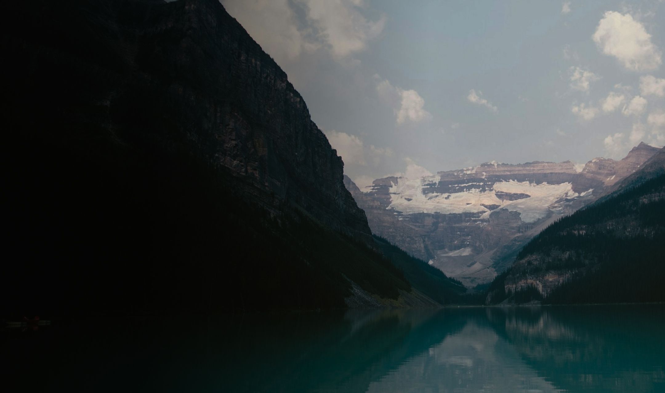 Mountain lake landscape with snow-capped peaks representing clarity
