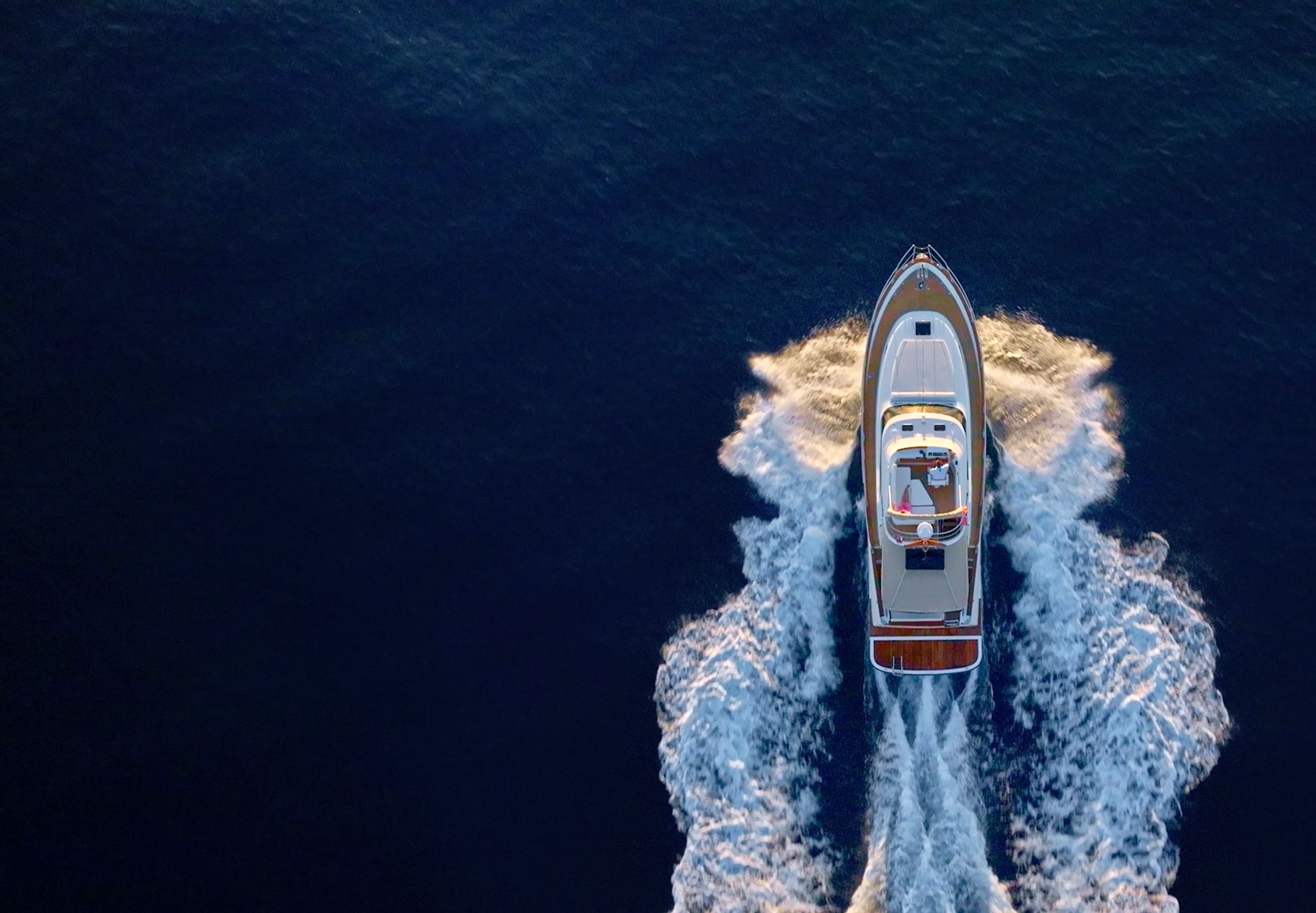 Luxury yacht cruising on open water symbolizing wealth and freedom